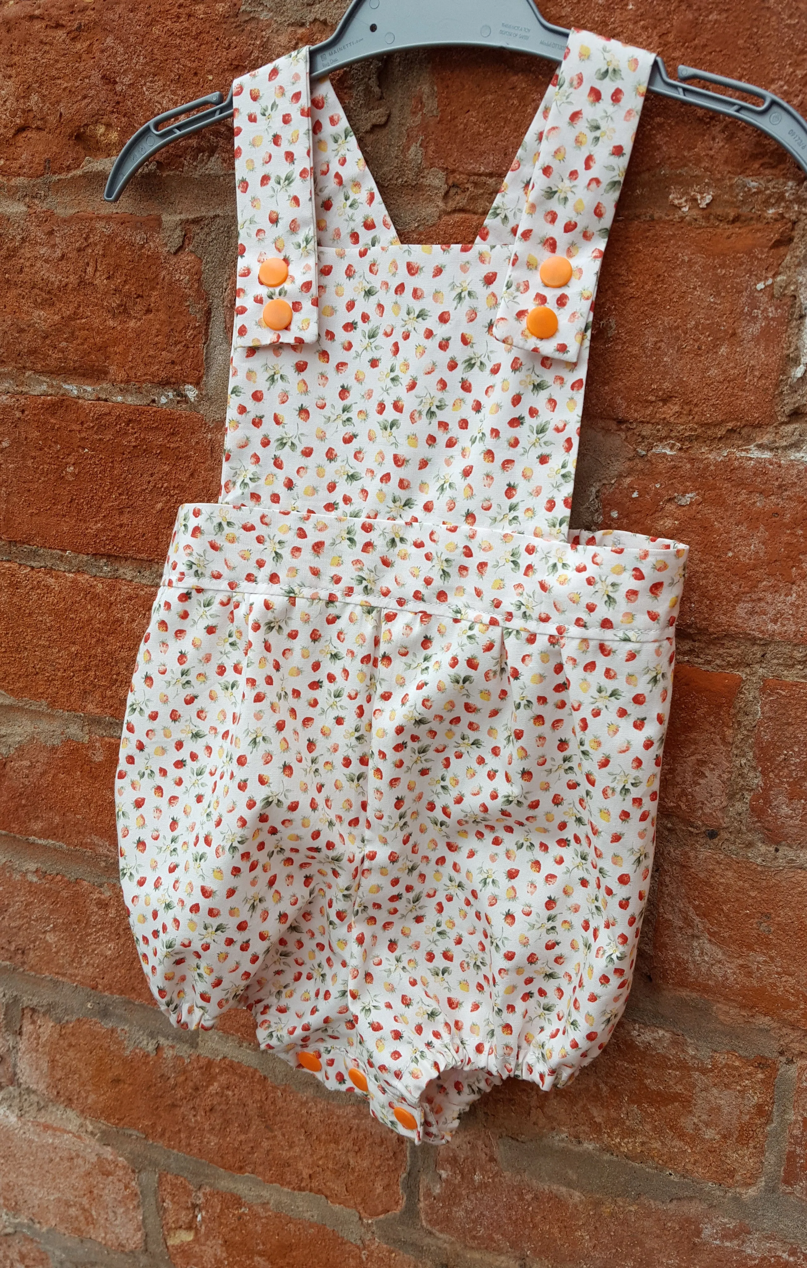 Handmade baby romper to fit 6 months upwards, 100%  cotton strawberry print.